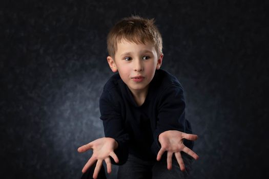 Funny little boy shows his hands.Child at four years old.