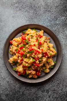 Middle eastern and Mediterranean traditional vegetable salad tabbouleh, from above. Arab snack or appetizer, light and healthy food, top view .