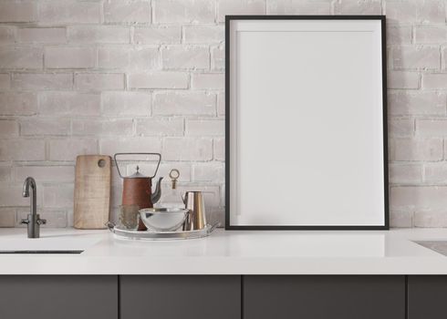 Empty vertical picture frame standing in modern kitchen. Mock up interior in minimalist, contemporary style. Free, copy space for your picture, poster. Close up view. 3D rendering