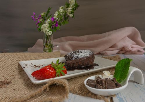 chocolatecoulant with strawberries with flower background sweet dessert