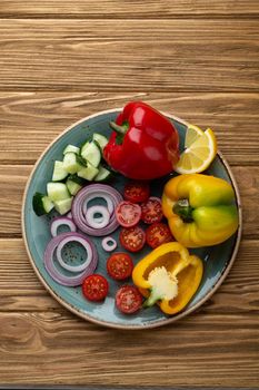 A bowl of fruit sitting on top of a wooden table. High quality photo