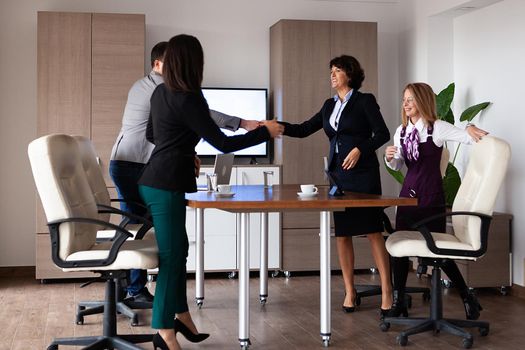 Business people discussing together in conference room during meeting at office. Professional team.