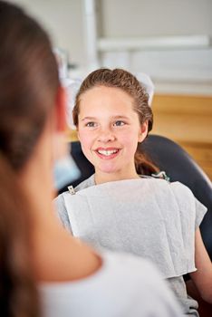 At ease in the dentists chair. a young girl at the dentist