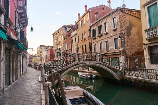 Venice, Italy - October 13, 2021: Bridge over the canal in Venice. Streets of the Italian city of Venice.