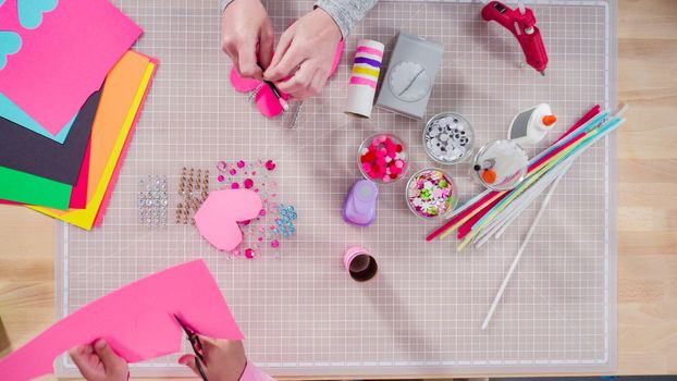 Flat lay. Kids papercraft. Making paper bugs out of the empty toilet paper rolls and construction paper.