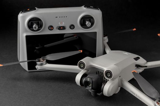 Antalya, Turkey - September 15, 2022: Mini 3 Pro drone of Dji brand with Vertical camera on dark background