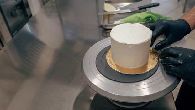 chef at work preparing a drip cake