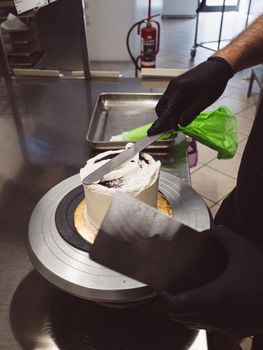 chef at work preparing a drip cake