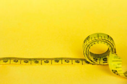Measuring tapes with customizable space for text or ideas. Copy space and weight loss concept.