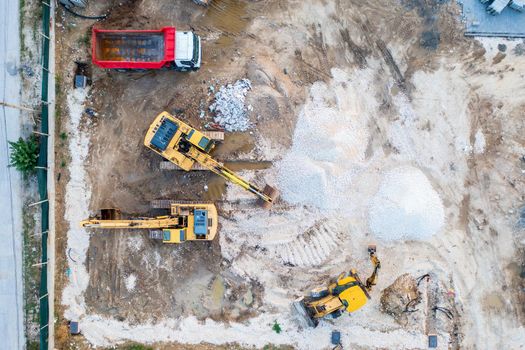 aerial top view of a construction site with heavy machines