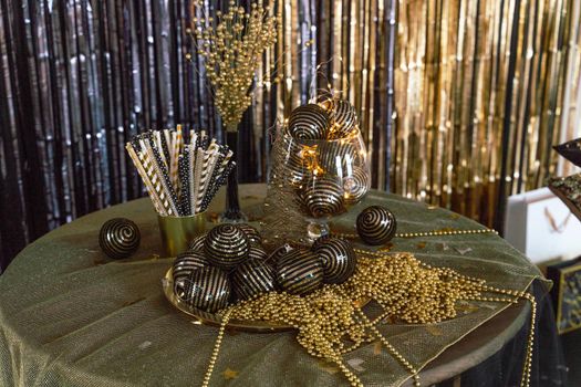 Bright Christmas decor. Christmas and New Year interior in black and gold colors. Winter holiday background.