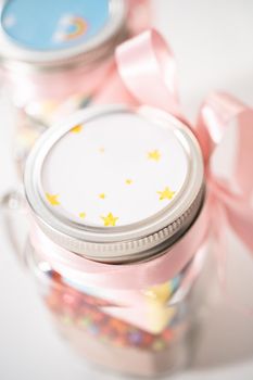 Making unicorn hot chocolate mix in drinking mason jar as a food gift.