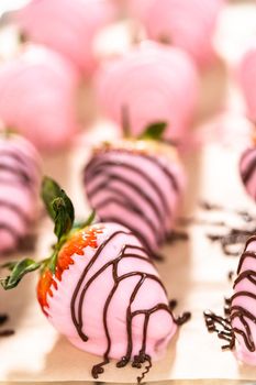 Chocolate dipped strawberries drizzled with melted chocolate.