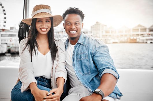 Couple, love and yacht with a man and woman on a date on the sea or ocean with the city, harbor or promenade in the background. Dating, romance and affection with a diverse male and woman outdoor.