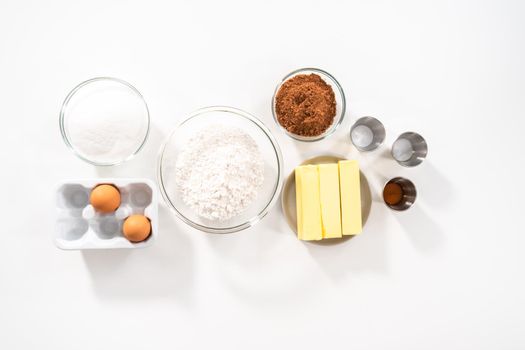 Flat lay. Ingredients in mixing bowls on the counter to bake chocolate cookies.