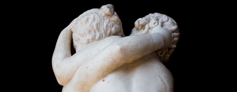 ROME, ITALY - CIRCA AUGUST 2020: togetherness emotion. Statue of two people embracing with passion