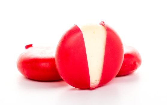 Piece of camembert cheese on white background isolated