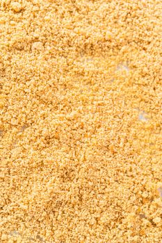 Cooling freshly dried bread crumbs on a baking sheet lined with parchment paper.