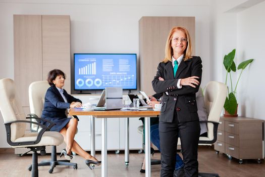 Happy beautiful bussines woman in conference room. Successful woman.