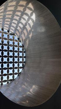 Interesting and unique artistic building roof pattern and texture for backgrounds against blue sky