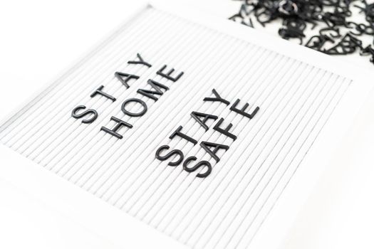 STAY HOME and STAY SAFE sign on message board.