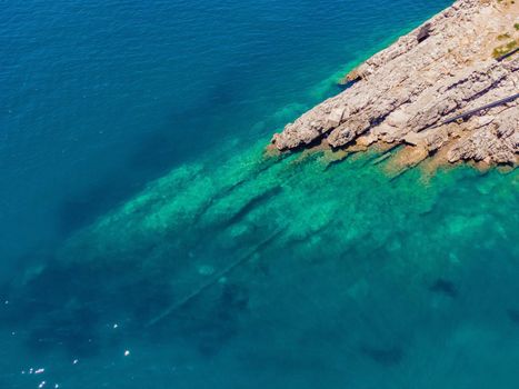 The pipe drains the sewer into the sea. Environmental pollution. Drone view.