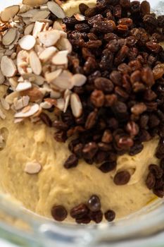 Mixing ingredients in kitchen mixer to bake mini Easter bread kulich.