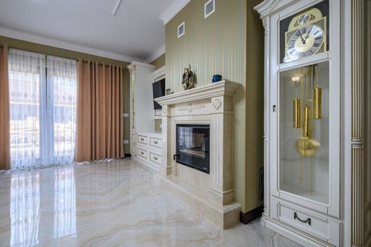 Classic living room interior design. Spacious room, luxury marble floor, elegant chairs and even fireplace
