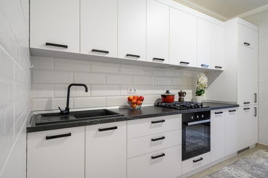Trendy snow white modern kitchen interior showcase with minimalistic furniture