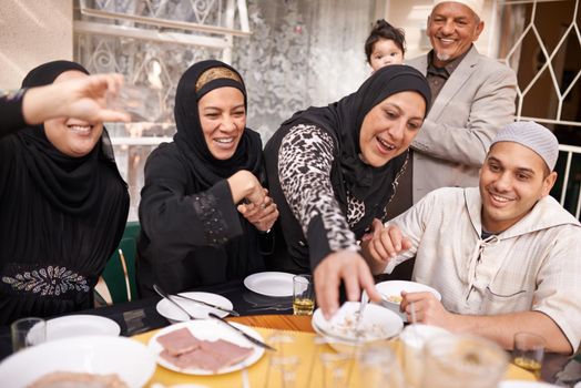 I made enough for everyone. a muslim family eating together
