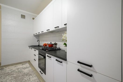 Trendy snow white modern kitchen interior showcase with minimalistic furniture