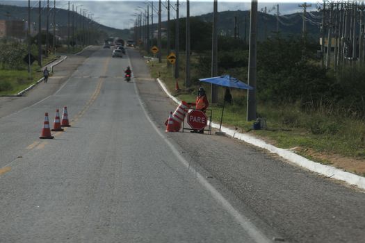 serra preta, bahia, brazil - september 13, 2022: workers recovering the BA 052 highway lane in the city of Serra Preta.
