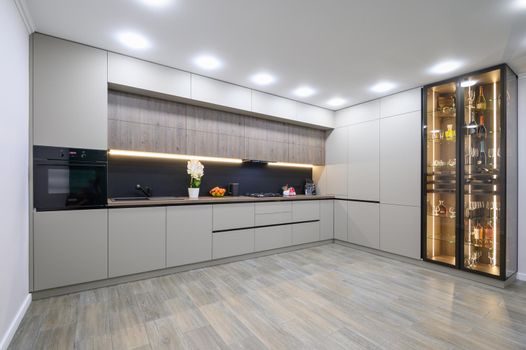 Trendy grey modern kitchen interior showcase with minimalistic furniture