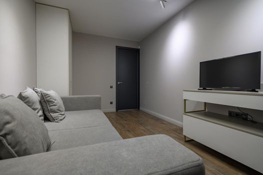Cozy and luxury bedroom in shades of grey with elegant and modern details