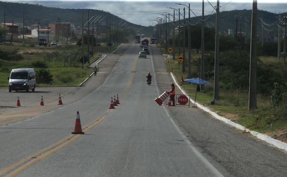 serra preta, bahia, brazil - september 13, 2022: workers recovering the BA 052 highway lane in the city of Serra Preta.