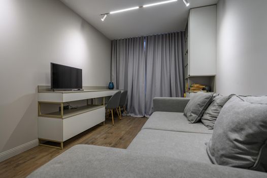 Cozy and luxury bedroom in shades of grey with elegant and modern details