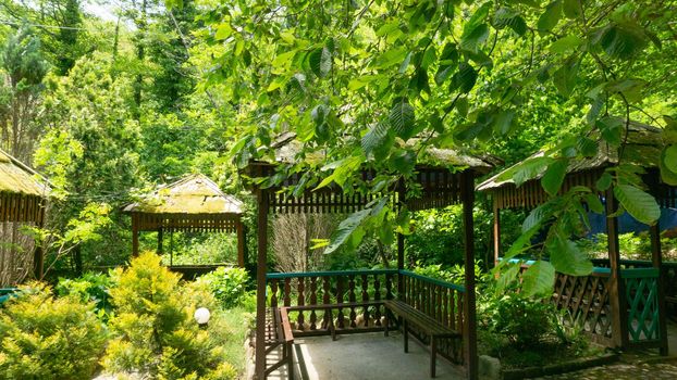 LAZAREVSKOE, SOCHI, RUSSIA - MAY, 29, 2021: Gazebos for tourists in the recreation area of Berendeevo Kingdom, Sochi