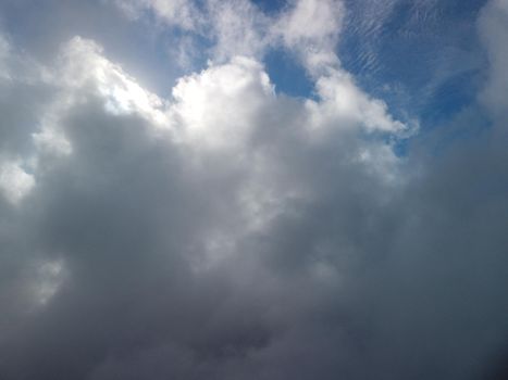 Aerial view drone flying above white clouds dense fog move quickly. Drone flies high back in blue sky through fluffy clouds. Beautiful foggy and cloudy slow moving Aerial view. Fog sea.