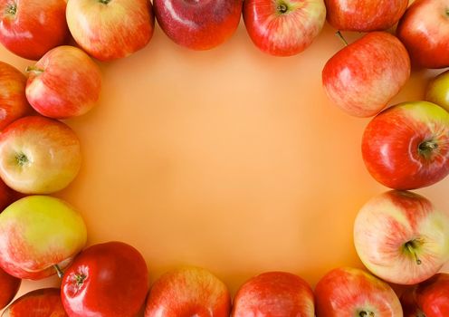 Freshly picked apples are laid out on the edge of the background. High quality photo