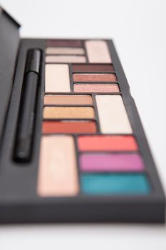 Vertical close up of colorful eyeshadow pallete