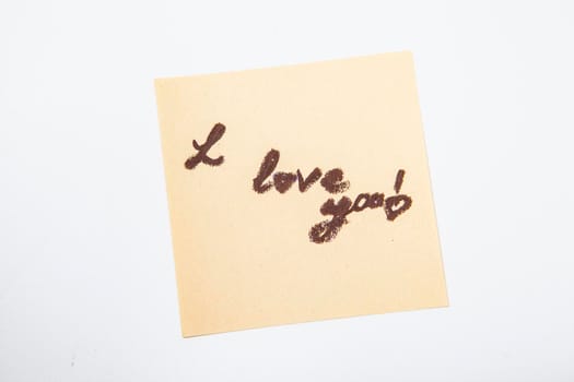 I love you note written on yellow sticker paper