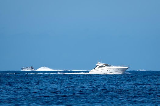 Small white yacht sailing the sea