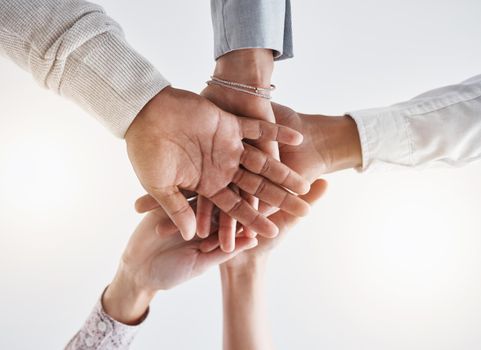 Teamwork hands, partnership and collaboration support for winner, motivation and vision of goals. Below business group people connect in trust, success commitment and working for solidarity together.