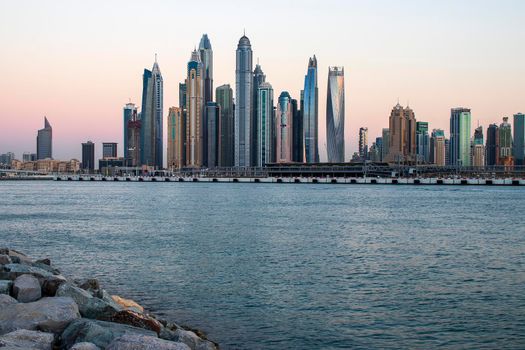 View of A Dubai Marina during sunset hour. Shot made from Palm Jumeirah, man made island. Dubai, UAE. Outdoors.