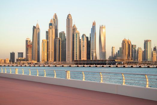 View of A Dubai Marina during sunset hour. Shot made from Palm Jumeirah, man made island. Dubai, UAE. Outdoors.