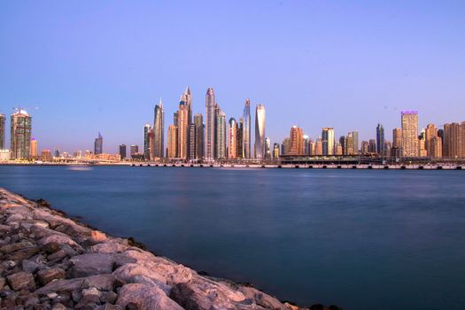 View of A Dubai Marina after sunset. Shot made from Palm Jumeirah, man made island. Dubai, UAE. Outdoors.
