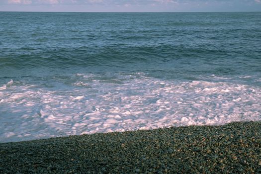 Small seaside waves near the coastline of the Black Sea.