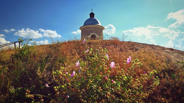 South Moravia - wine region. A beautiful little chapel above the vineyards. Summer landscape with nature in the Czech Republic. (Hradistek - Velke Bilovice)