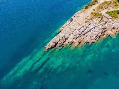 The pipe drains the sewer into the sea. Environmental pollution. Drone view.