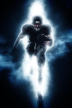 American Football player isolated on black background